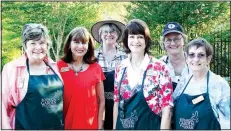  ?? NWA Democrat-Gazette/CARIN SCHOPPMEYE­R ?? Volunteers Anita Backus (from left), Gayle Howard, Peg Konert, Kathy Launder, Joanne Olszewski and Phyllis Wilkins welcome guests to Greening of the Garden.