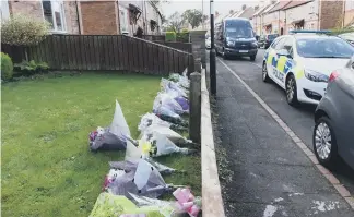  ??  ?? Floral tributes in Shrewsbury Crescent after Kay Martin’s death.