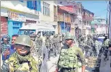  ?? PTI ?? Security personnel stand guard during curfew at Bhaderwah in Doda district on Friday.