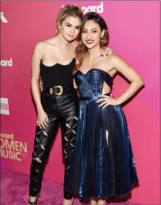  ?? MICHAEL KOVAC, GETTY IMAGES ?? Selena Gomez, left, and Francia Raisa at the Billboard Women In Music on Nov. 30 in Hollywood.