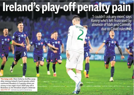  ?? STEPHEN McCARTHY/SPORTSFILE ?? Matt Doherty shuffles away after missing Ireland’s fourth penalty which confirmed Slovakia’s 4-2 penalty shoot-out victory in last night’s Euro 2020 play-off in Bratislava as the Slovakian players celebrate