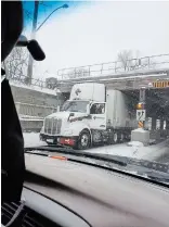  ?? MELISSA MOORE, FACEBOOK ?? A truck gets stuck under the Kenilworth bridge recently. Photos and videos of trucks wedged under the east-end underpass regularly show up on social media.
