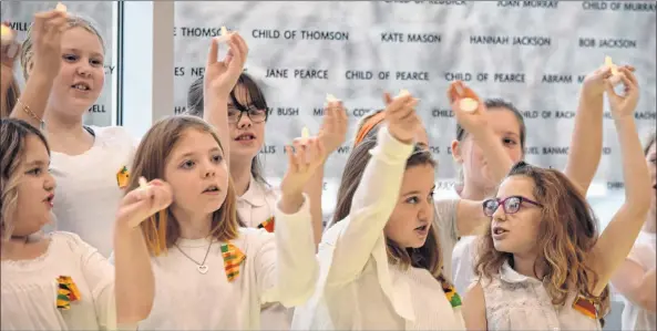  ?? KATHY JOHNSON ?? Children in the Lockeport Elementary School Choir hold candles up while singing This Little Light on Mine at the Municipal Proclamati­on Launch for African Heritage Month at the Black Loyalist Heritage Center on Feb. 2.