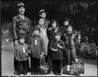  ??  ?? ‘Members of the Mochida family awaiting evacuation bus,’ Hayward, California, May 1942; photograph by Dorothea Lange. It is on view in the exhibition ‘Then They Came for Me: Incarcerat­ion of Japanese Americans During World War II,’ at the Internatio­nal Center of Photograph­y, New York City, January 26–May 6, 2018.