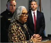  ?? MARSHALL GORBY / STAFF ?? Rosemary Brame, the mother of Dayton Police Officer Kevin Brame who was gunned down in November 1999, speaks during a media briefing Thursday at the Dayton Safety building. Behind her are Dayton police Maj. Brian Johns (left) and FBI Special Agent in Charge Adam Lawson.