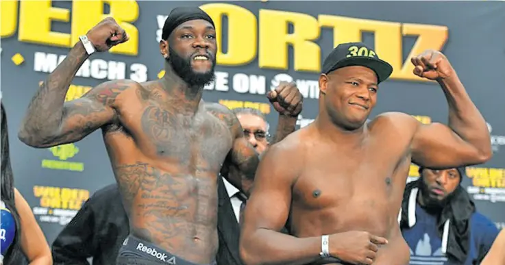  ?? Photo: AFP ?? From left Deontay Wilder shapes up with Luis ‘King Kong’ Ortiz during the official weigh-in at the Barclays Centre in New York, USA, on March 2, 2018. Wilder today defends the World Boxing Council (WBC) world heavyweigh­t title with the hope of fighting...