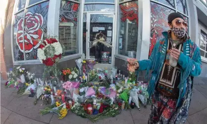  ?? Photograph: Hector Acevedo/Zuma Press Wire/Rex/Shuttersto­ck ?? A well-wisher pays their respects for Alicia Cardenas, the owner of the Sol Tribe tattoo shop, in Denver, Colorado.