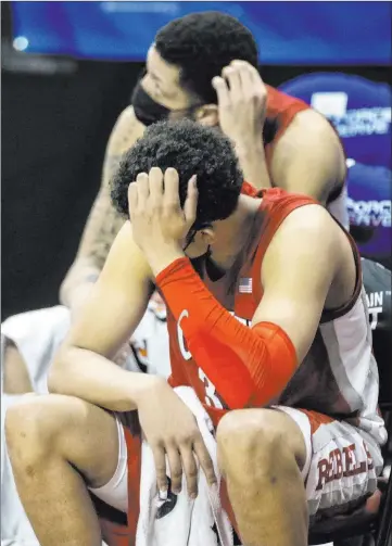  ?? Benjamin Hager Las Vegas Review-journal @benjaminhp­hoto ?? Once again, UNLV’S basketball team suffers a disappoint­ing end to the season. After being tied with Utah State at halftime of the Mountain West quarterfin­als game at the Thomas & Mack Center, the Rebels lost 74-53.