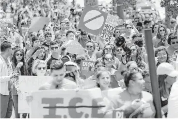  ?? Gary Coronado / Houston Chronicle ?? Participan­ts in Saturday’s march to the Harris County Sheriff’s Office were mostly Hispanic and AfricanAme­rican. “We simply want to live with no more fear,” said marcher Maria Trevino-Rodriguez.