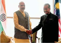  ?? — PTI ?? Prime Minister Narendra Modi meets Malaysian Prime Minister Mahathir Bin Mohamad in Kuala Lumpur, Malaysia, on Thursday.