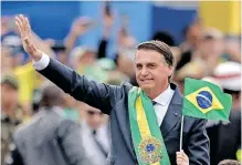  ?? AFP ?? BRAZILIAN President Jair Bolsonaro waves to the crowd during a military parade to mark the country’s 200th anniversar­y of independen­ce in Brasilia, this week. |