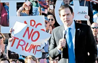  ?? STEVE HELBER/AP ?? Supporters of Marco Rubio denounce Donald Trump during a rally for the Florida senator Sunday in Richmond, Va.