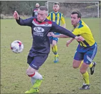  ??  ?? Saints striker Shaun MacIver, who scored two goals, takes on Hillington defender Neil Walsh.