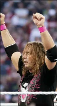  ?? RICK SCUTERI — THE ASSOCIATED PRESS ?? In this March 28, 2010, file photo, Bret “Hit Man” Hart celebrates his victory over Mr. McMahon at WrestleMan­ia XXVI in Glendale, Ariz.