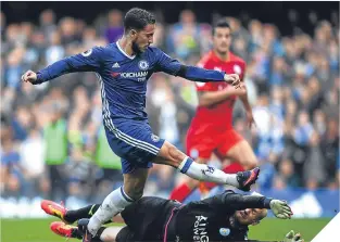  ??  ?? Eden Hazard scores Chelsea’s second goal.