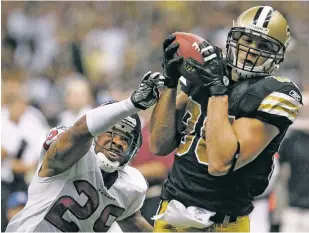  ?? ASSOCIATED PRESS FILE PHOTO ?? New Orleans Saints tight end Jimmy Graham, right, catches a ball for a 27-yard touchdown as Houston Texans strong safety Glover Quin defends during a September 2011 game in New Orleans. The Seattle Seahawks and the Saints agreed to a trade Tuesday,...