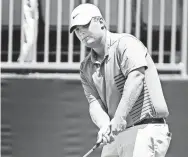  ?? MARK WEBER/THE COMMERCIAL APPEAL ?? Braden Thornberry chips onto the 18th hole green during first-round action in the FedEx St. Jude Classic.