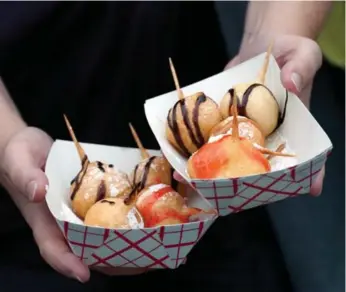  ?? RICK MADONIK/TORONTO STAR FILE PHOTO ?? 2010: Deep-fried butter launched the outrageous food era at the CNE.