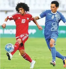  ?? Courtesy: UAE FA ?? UAE’s Omar Abdul Rahman (left) controls the ball during a friendly match against Uzbekistan on Tuesday.