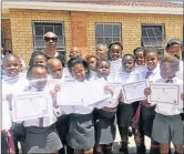  ?? Picture: QAQAMBA MAGADLA ?? PROUD DAY: Pupils from Mzamowethu Public School, in Mzamomhle informal settlement, show off their certificat­es after the school hosted its first awards ceremony for its foundation phase