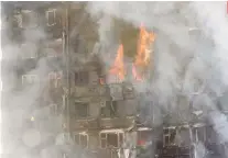  ?? PA VIA AP ?? GUTTED. A massive fire guts the 24-story building in North Kensington.