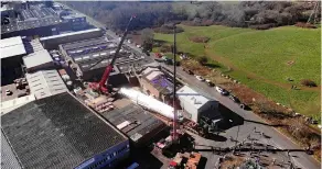  ?? Pic: John Rawlings ?? Giant cranes lift the Boeing into position at the business park