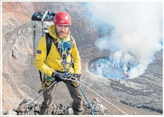  ??  ?? Aldo abseils into the Nyiragongo volcano in the Democratic Republic of Congo in 2018