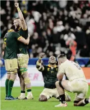  ?? Lewis Joly/Associated Press ?? South Africa players celebrate after defeating England 16-15 in the Rugby World Cup semifinal match.