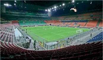  ?? — AP ?? Inter Milan and Ludogorets compete inside an empty San Siro stadium in Milan, Italy, during their Europa League Round of 32 second leg football match on Thursday. The match was played behind closed doors as a precaution because of the coronaviru­s outbreak in Italy. Italian league’s governing body released a statement announcing that Sunday’s Italian Derby — between Juventus and Inter Milan — one of the biggest games of the season, and four others will be played without any fans allowed into the San Siro.