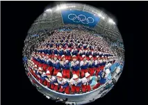  ?? PHOTO: GETTY IMAGES ?? North Korean cheerleade­rs sing during the men’s ice hockey preliminar­y round at Gangneung, South Korea.