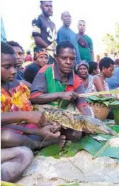  ??  ?? On the market … a crocodile for sale at Angoram.