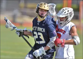  ?? Dan Watson/The Signal ?? West Ranch’s Zachary Van Bennekum (23) takes the ball to the goal in the second period against Hart defender Jacob Montez (7) at Hart on April 26.