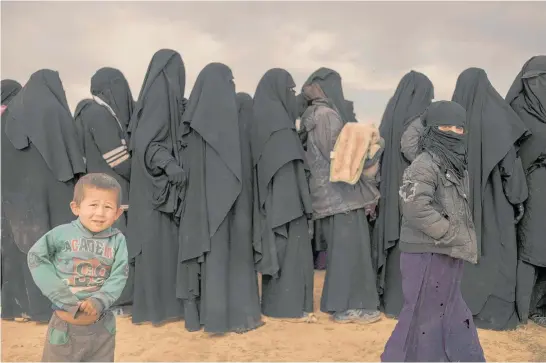  ?? Photos / AP ?? Thousands of women and children have been been evacuated in recent weeks from Baghouz, where Isis militants continue to impose their rule of fear and brutality.