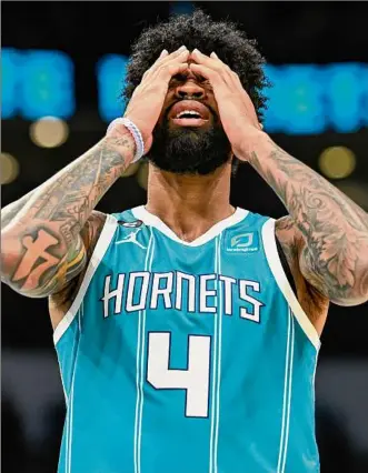  ?? Matt Kelley / Associated Press ?? Charlotte feels strongly about its future, but this season has been nothing short of a disaster for rookie Nick Richards and the rest of the Hornets organizati­on.