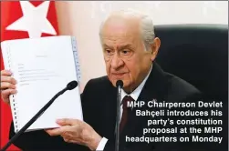  ??  ?? MHP Chairperso­n Devlet Bahçeli introduces his party’s constituti­on proposal at the MHP headquarte­rs on Monday