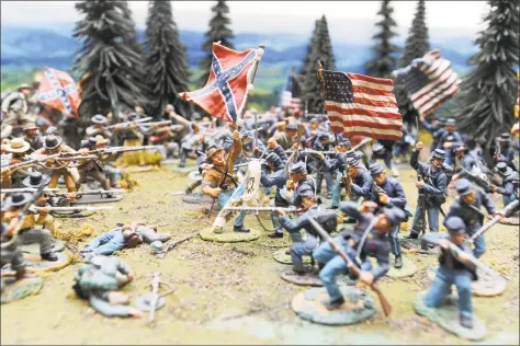  ?? Michael Cummo / Hearst Connecticu­t Media ?? A Civil War scene from one of Charles Trudeau’s many historical dioramas in his home in Stamford on May 15. Trudeau’s collection began when he moved to Stamford in 1981 and he now has more than 10,000 toy soldiers and nearly 150 reference books.
