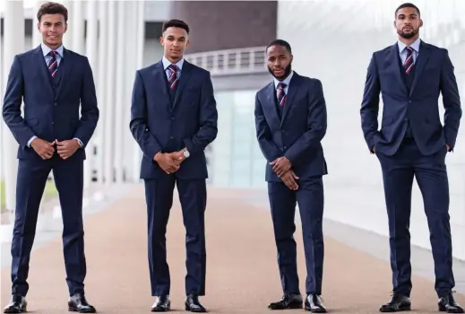  ??  ?? Looking sharp: Dele Alli, Trent Alexander-Arnold, Raheem Sterling and Ruben Loftus-Cheek in suits for their official photo