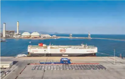  ?? ?? A “ro-ro” cargo vessel, carrying more than 5,000 new energy vehicles, embarked on its maiden voyage from Shenzhen Port in south China’s Guangdong Province on January 15. — CFP