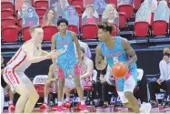  ?? UNM ATHLETICS. ?? New Mexico’s Rod Brown (5) dribbles the ball during the Lobos’ 77-54 loss on Saturday to UNLV at the Thomas & Mack Center in Las Vegas, Nevada.