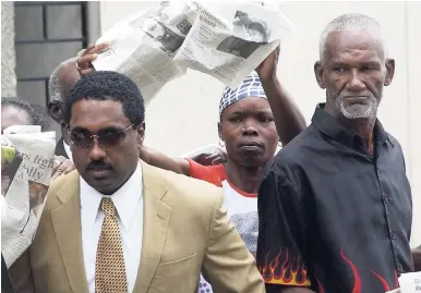  ?? FILE ?? In this October 2005 photo, Danhai Williams (left) with supporters as he approached the Supreme Court for his trial in relation to the Operation PRIDE case.