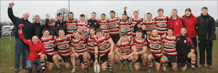  ??  ?? The Enniscorth­y players and backroom team celebrate their outright Leinster League Division 1A victory on Saturday.