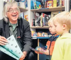  ??  ?? Pictured is Colin Granger showing children his book. Image courtesy of David Monteith-Hodge.