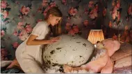  ?? IFC FILMS ?? A large egg creates unsavory attention for a blogging family in “Hatching,” screening at Sundance.