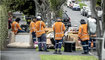  ?? JASON DORDAY/STUFF ?? The big cleanup is under way in Auckland, where insurance companies are run off their feet processing claims after flooding that ruined fittings and even left some property owners dealing with major slips.