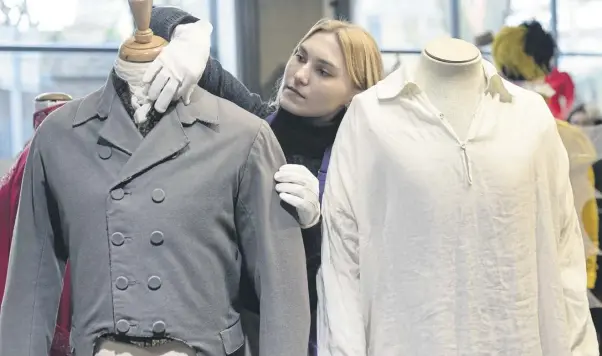  ?? ?? The infamous wet shirt (right) as worn by Colin Firth in Pride and Prejudice on display at the “Lights Camera Auction” photocall at Kerry Taylor Auctions. Photo: Getty Images