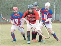  ?? Photograph: Donald Cameron. ?? Kingussie’s Darren Hanlon and Lewis Thain close in on Glenurquha­rt’s Cairn MacDonald during last weekend’s North Division One encounter.