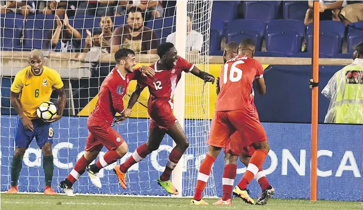  ?? — GETTY IMAGES ?? Midfielder Alphonso Davies (No. 12) celebrates after scoring one of the two goals he notched on Friday night in Canada’s victory over French Guiana.