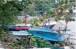  ?? Pic by Shirangika Lokuhapuar­achchi ?? Galle: Last week boats anchored at sea were pushed inland due to strong winds and waves.