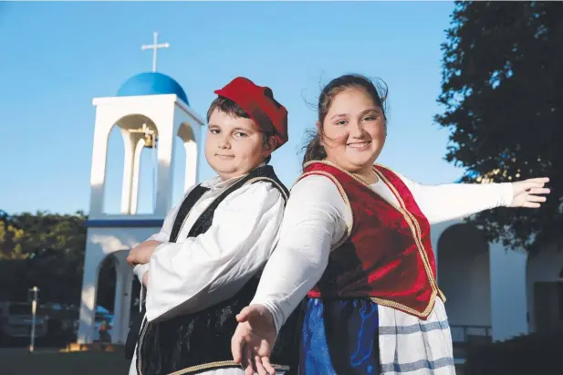  ?? Picture: ANNA ROGERS ?? FESTIVE FUN: Zac and Stella Tremayne invite everyone to experience traditiona­l Greek culture at the St John’s Greek Festival on Sunday.