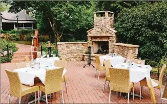  ?? CONTRIBUTE­D BY TABLE & MAIN ?? Table &amp; Main is a cozy restored homestead complete with an outdoor fireplace on lively Canton Street in Roswell.